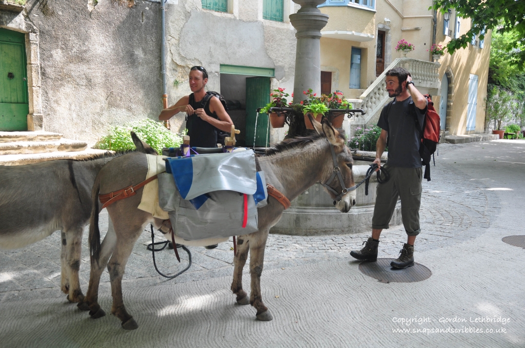 Walking with a donkey through one of the villages of the Cevennes