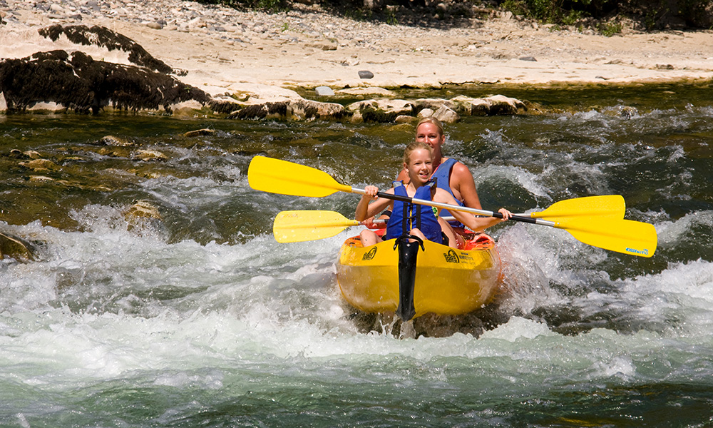 Ardeche Gorge canoe wildwater rapids parent and child paddling