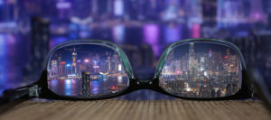 Where in the World 506 featured image City through glasses