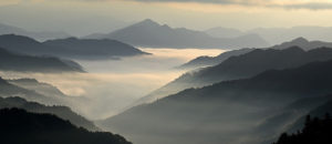 Where in the World 467 featured image mist in the valley landscape