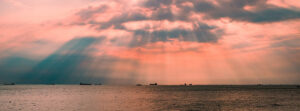 Where in the World 525 featured image clouds and sunset ocean