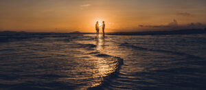 Where in the World 559 featured image couple at sunset