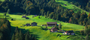 Featured image alpine meadow and houses in summer
