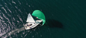 Featured image sailing boat yacht on dark sea aerial photograph