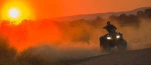 Where in the World 623 All Terrain Vehicle at sunset dusty