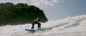 Where in the World 670 young surfer riding the waves