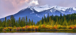 where in the World 719 featured image snow covered mountains forest and lake in autumn fall