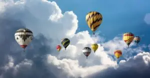 Travel insurance hot air balloons clouds and blue sky