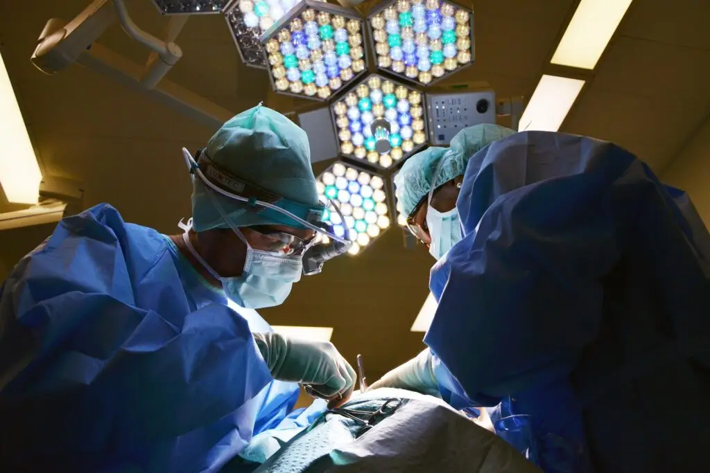 Travel insurance doctors in operating theatre medical procedure