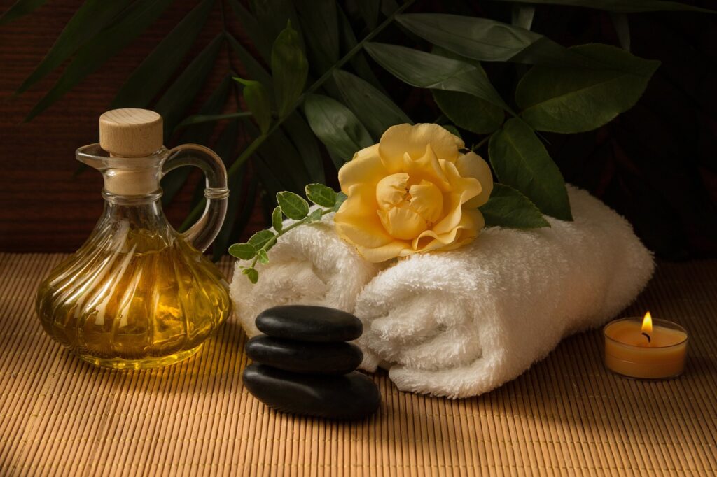Solo travel in retirement essential oil towel and yellow flower spa