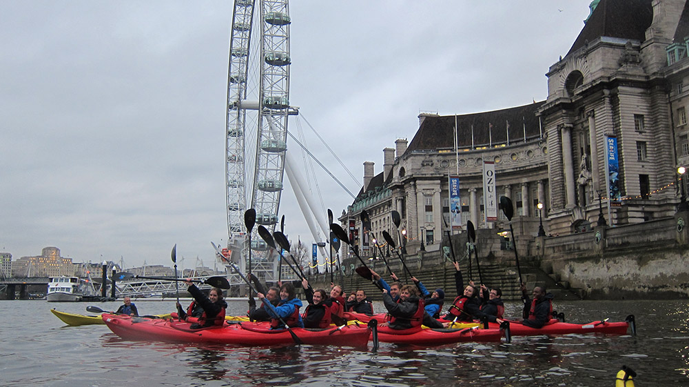Kayaking UK, kayakers on the River Thames close to the London Eye