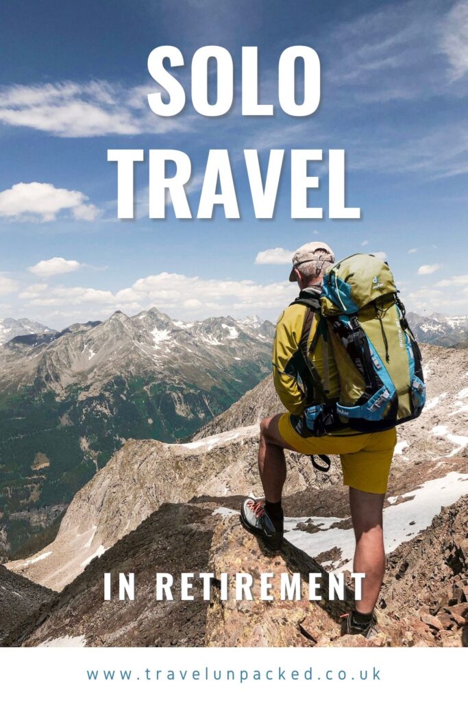 Solo Travel retirement man on a mountain peak Pinterest grphic