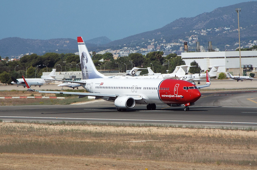 Budget airlines vs Spain Norwegian aircraft at airport