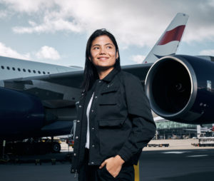 Emma Raducanu in front of British Airways jet