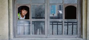 Where in the World 441 featured image child at window